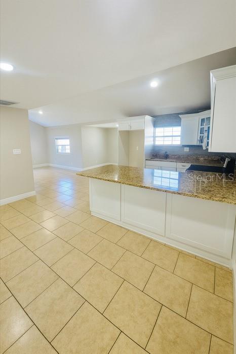 1310 West Burger Street Tampa, FL 33604 - Photo 4 of 14 a view of a kitchen with a sink and cabinets