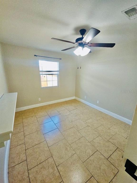 1310 West Burger Street Tampa, FL 33604 - Photo 7 of 14 a view of an empty room with a window