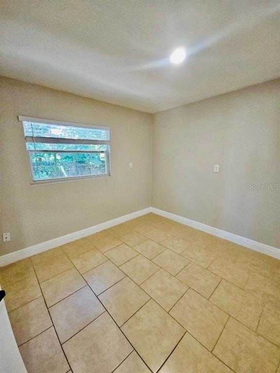 1310 West Burger Street Tampa, FL 33604 - Photo 10 of 14 a view of a room with an empty space and a window
