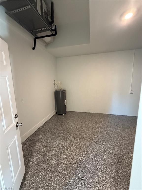 832 Holmes Avenue Lehigh Acres, FL 33974 - Photo 20 of 25 a view of a room with wooden floor