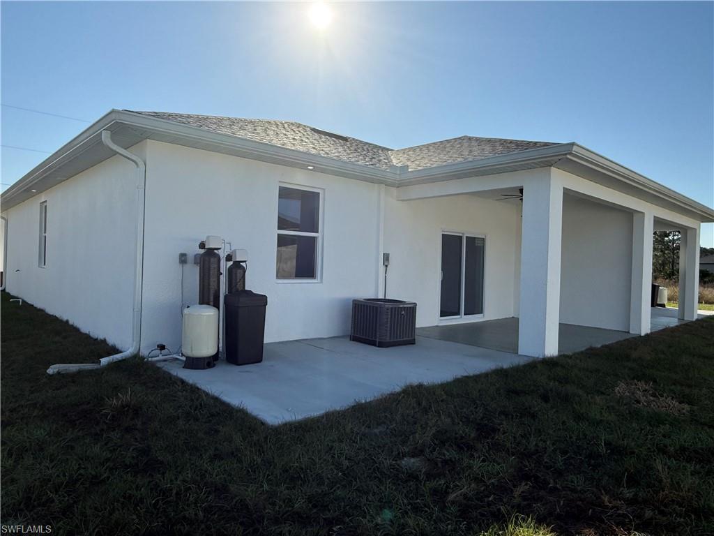 832 Holmes Avenue Lehigh Acres, FL 33974 - Photo 8 of 25 a view of a house with backyard and porch