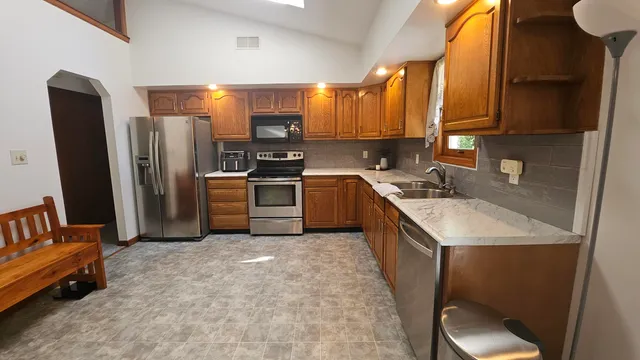 a view of a room with a table and chair