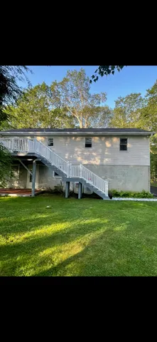 a dining room with furniture and chandelier