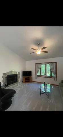 a view of a deck with a table and chairs