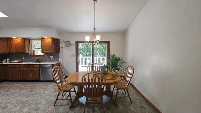 a kitchen with stainless steel appliances granite countertop a stove a sink a refrigerator and a microwave