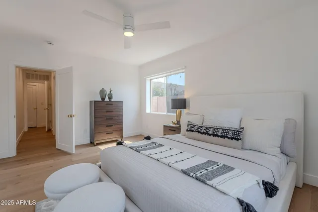 a bedroom with a bed and a couch