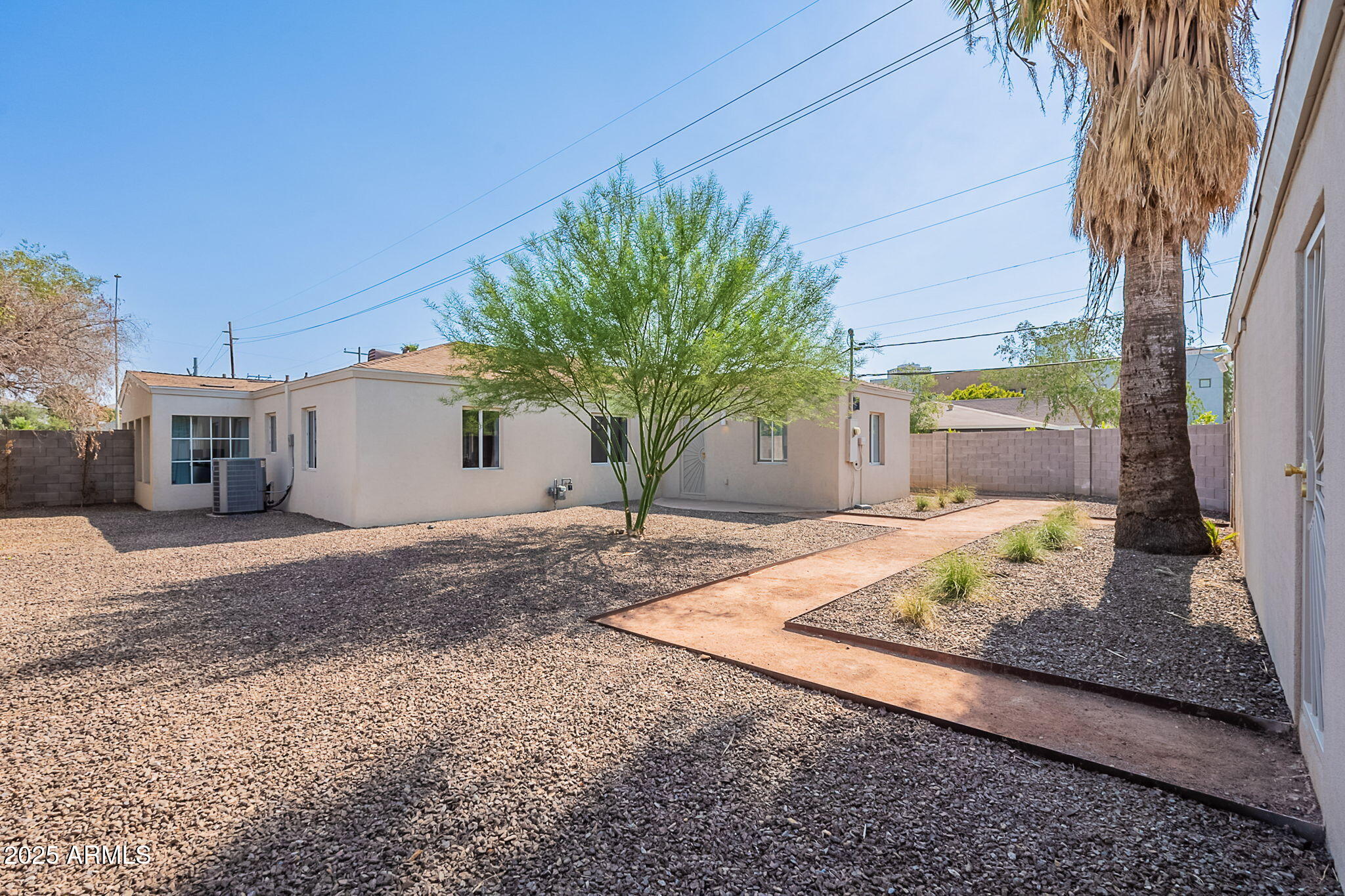 502 East Osborn Road Phoenix, AZ 85012 - Photo 14 of 24 a view of a backyard with a tree