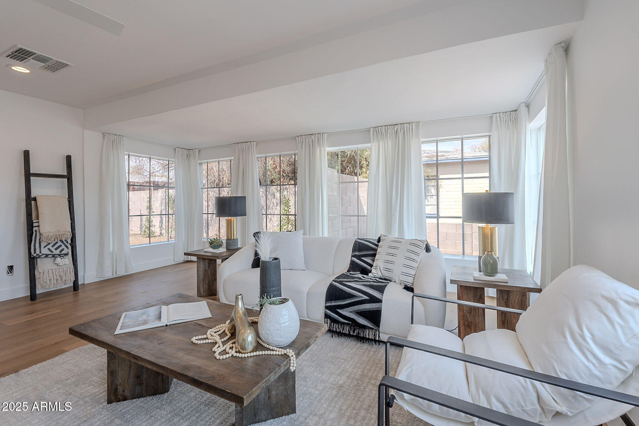 502 East Osborn Road Phoenix, AZ 85012 - Photo 20 of 24 a living room with furniture and wooden floor