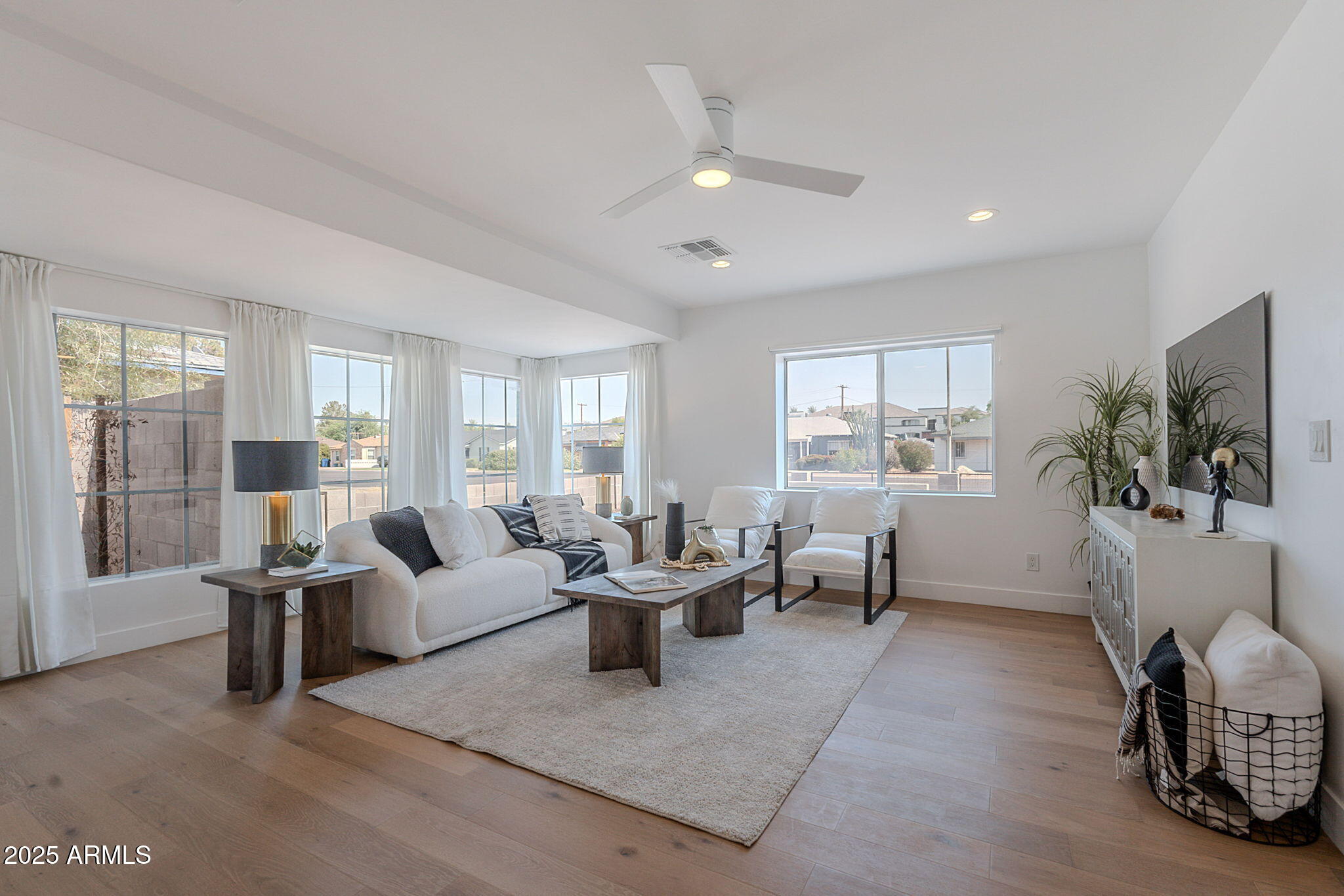 502 East Osborn Road Phoenix, AZ 85012 - Photo 2 of 24 a living room with furniture and a flat screen tv