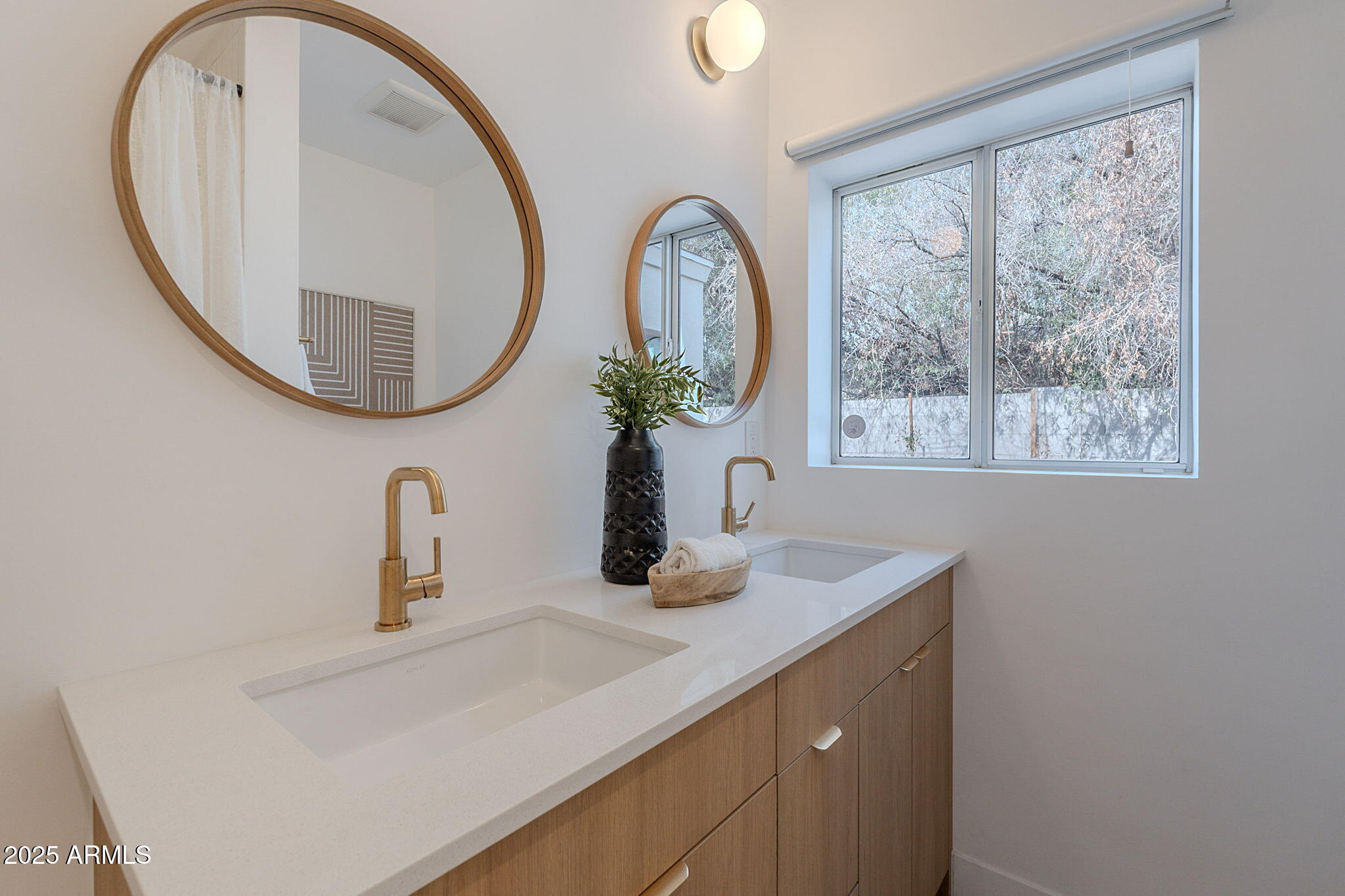 502 East Osborn Road Phoenix, AZ 85012 - Photo 6 of 24 a bathroom with a sink and a mirror