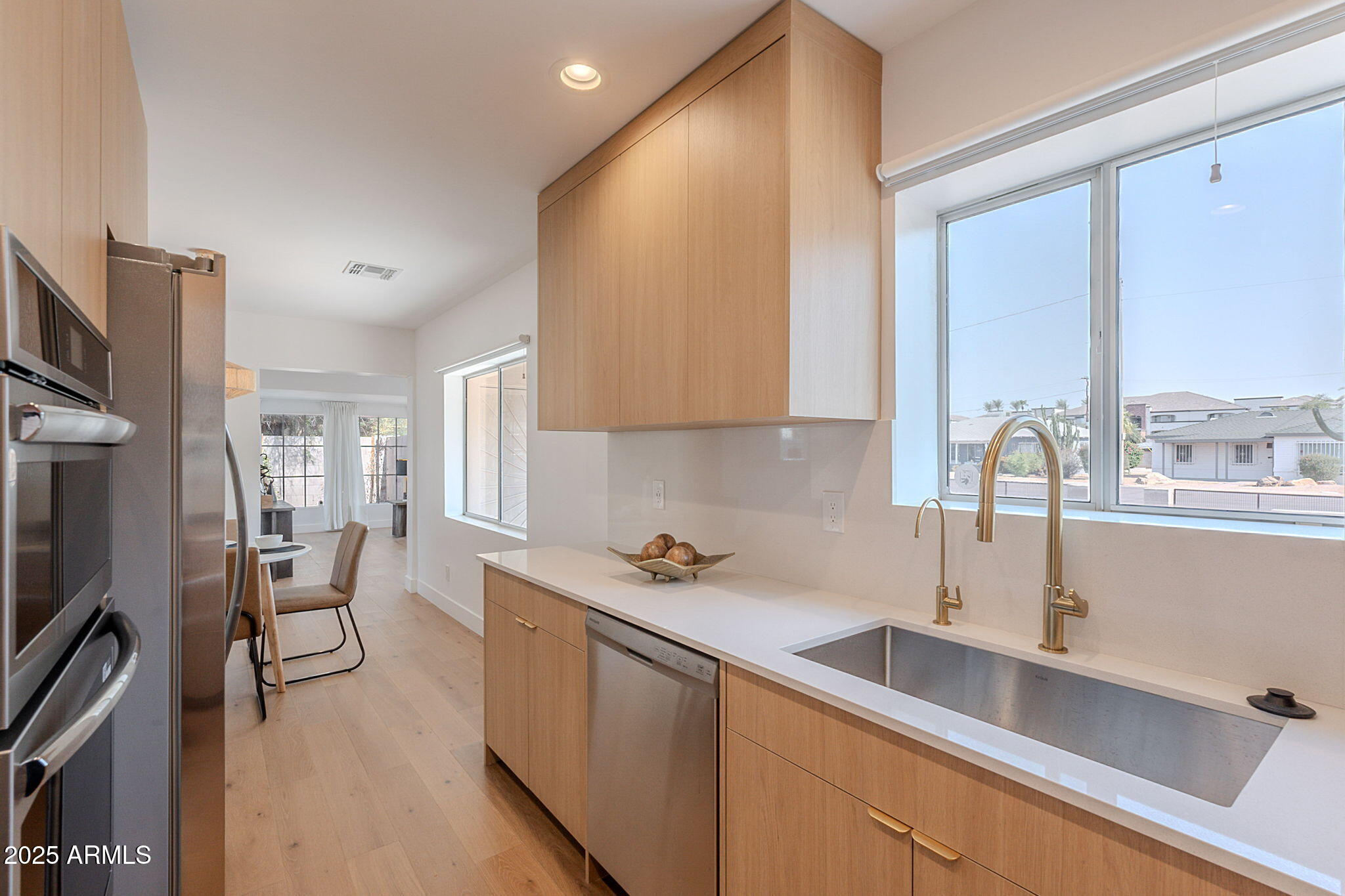 502 East Osborn Road Phoenix, AZ 85012 - Photo 8 of 24 a kitchen with a sink appliances and cabinets