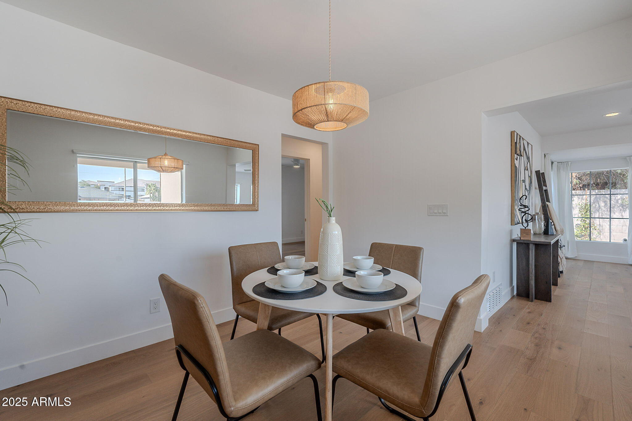 502 East Osborn Road Phoenix, AZ 85012 - Photo 10 of 24 a view of a dining room with furniture and wooden floor