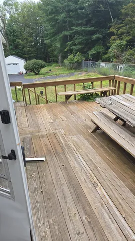 a view of swimming pool with a yard and seating area