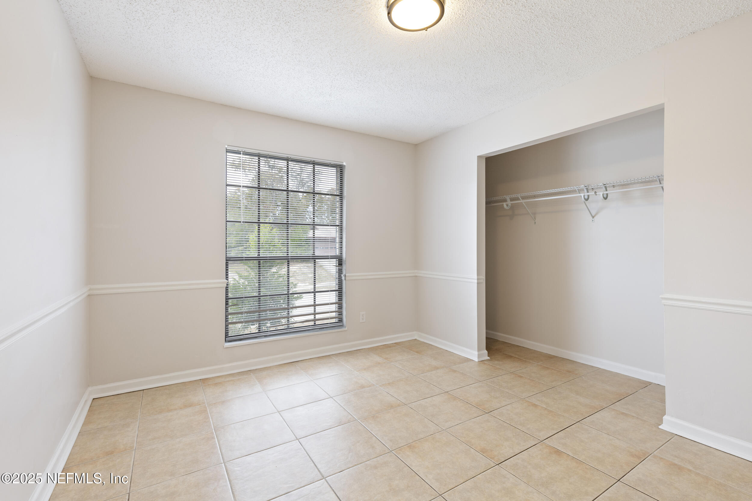 4135 Dawnridge Road East Jacksonville, FL 32277 - Photo 19 of 26 an empty room with windows
