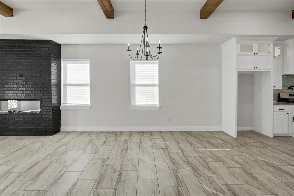 517 Highview Court Godley, TX 76044 - Photo 33 of 39 a view of empty room with wooden floor and fireplace