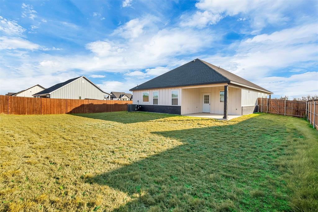 517 Highview Court Godley, TX 76044 - Photo 37 of 39 a view of a house with a big yard and large tree