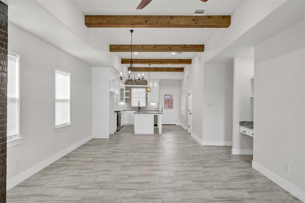 517 Highview Court Godley, TX 76044 - Photo 7 of 39 a view of a room with wooden floor and a window