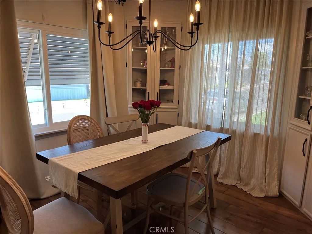 4000 Pierce Street, Unit 284 Riverside, CA 92503 - Photo 14 of 32 a view of a dining table and chairs in a room
