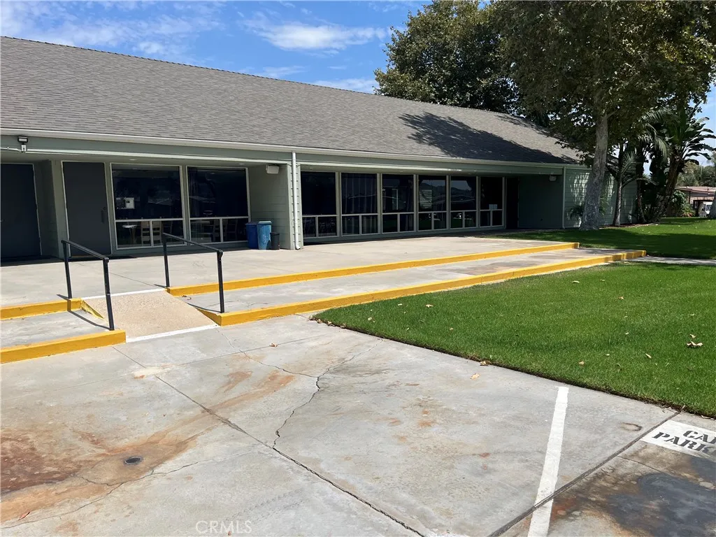 4000 Pierce Street, Unit 284 Riverside, CA 92503 - Photo 28 of 32 a view of a house with a yard and sitting area