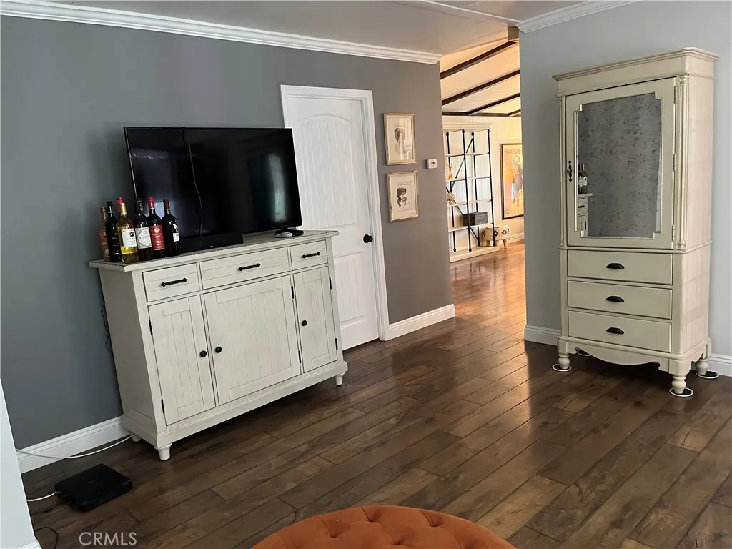 4000 Pierce Street, Unit 284 Riverside, CA 92503 - Photo 4 of 32 a living room with furniture and a flat screen tv