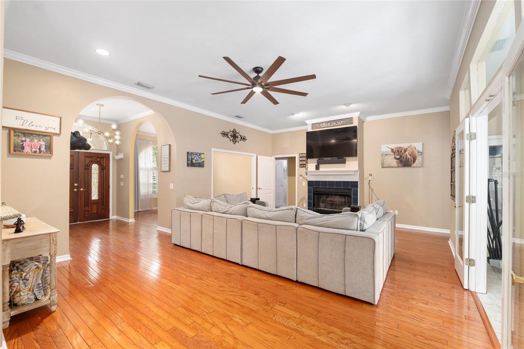 9350 Southwest 46 Place Gainesville, FL 32608 - Photo 12 of 63 a living room with stainless steel appliances kitchen island granite countertop a stove and a wooden floors