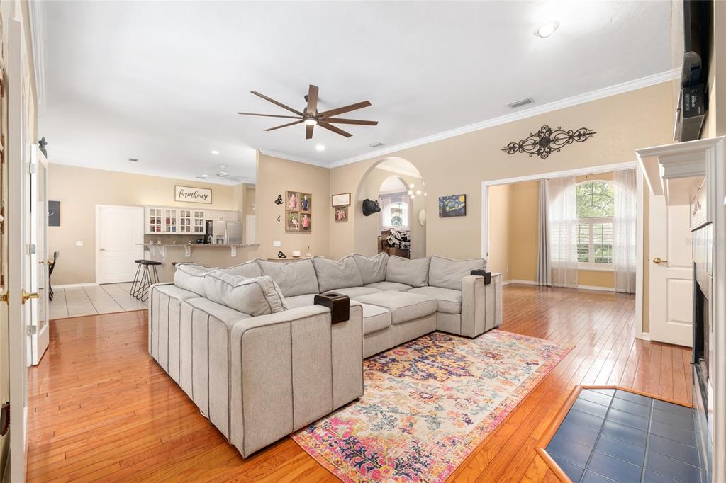 9350 Southwest 46 Place Gainesville, FL 32608 - Photo 17 of 63 a living room with furniture and a wooden floor
