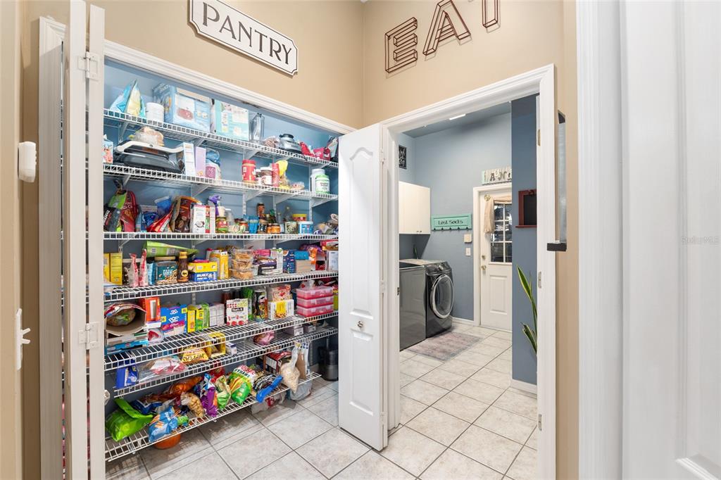 9350 Southwest 46 Place Gainesville, FL 32608 - Photo 29 of 63 a view of walk in closet with clothes and shoes