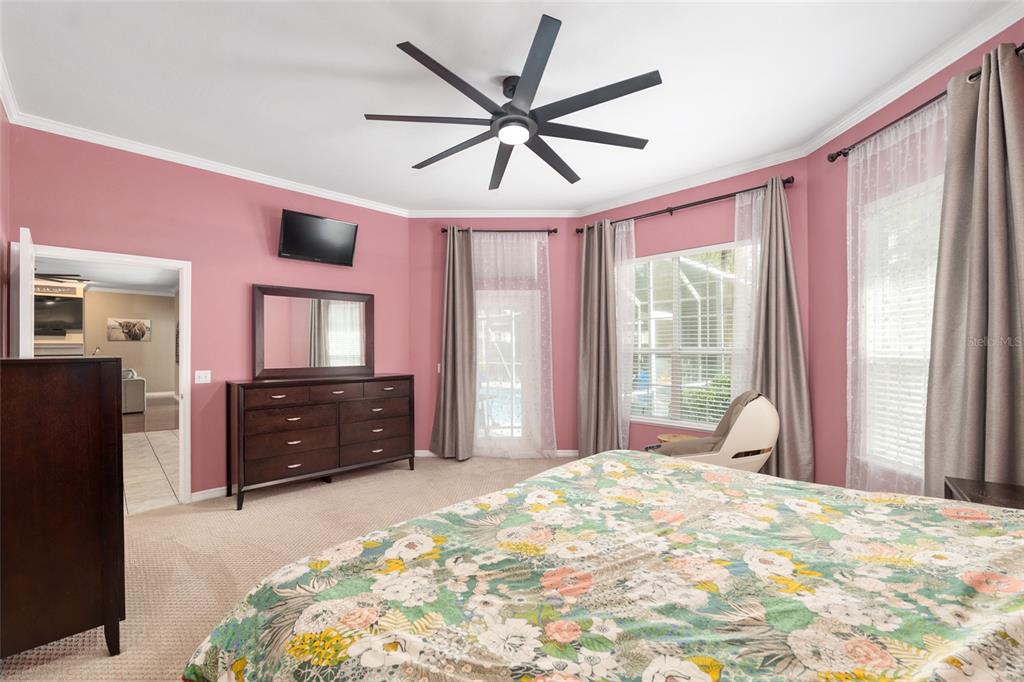 9350 Southwest 46 Place Gainesville, FL 32608 - Photo 33 of 63 a bedroom with a bed and a large window