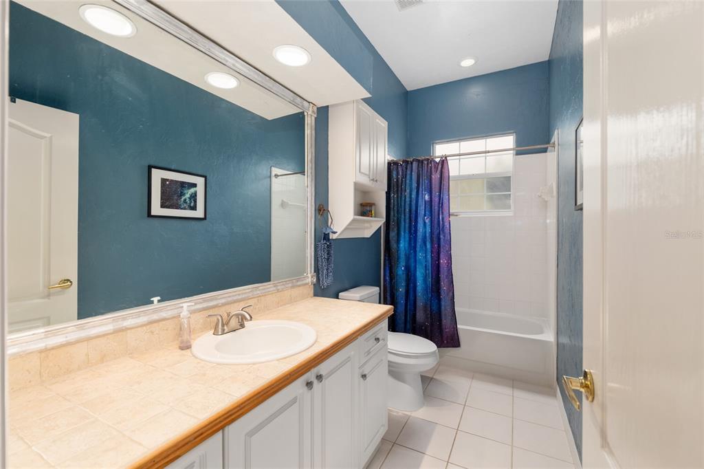 9350 Southwest 46 Place Gainesville, FL 32608 - Photo 43 of 63 a bathroom with a sink and a mirror