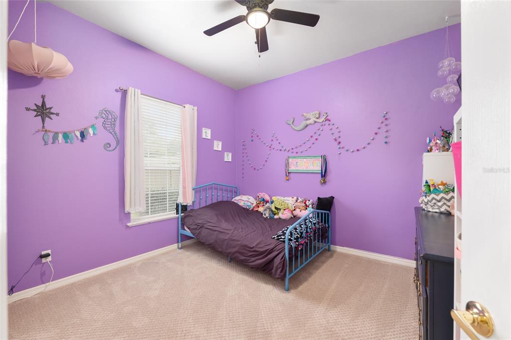 9350 Southwest 46 Place Gainesville, FL 32608 - Photo 47 of 63 a living room with furniture and a chandelier