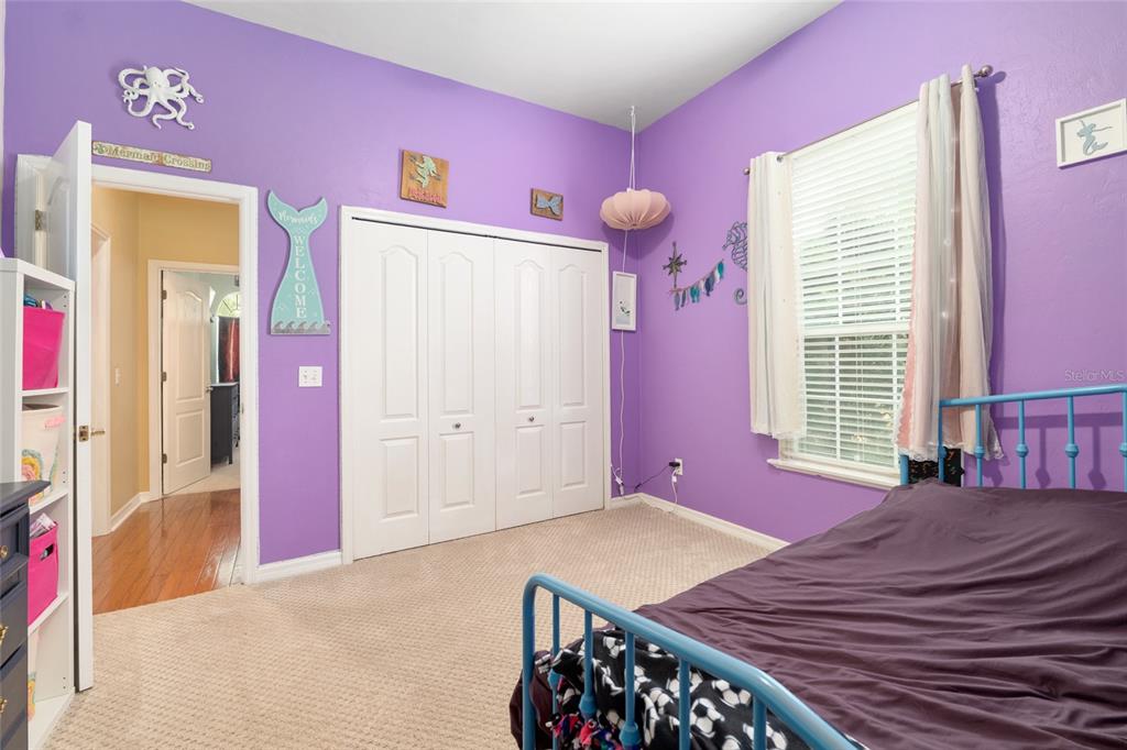 9350 Southwest 46 Place Gainesville, FL 32608 - Photo 48 of 63 a bedroom with a bed and a window