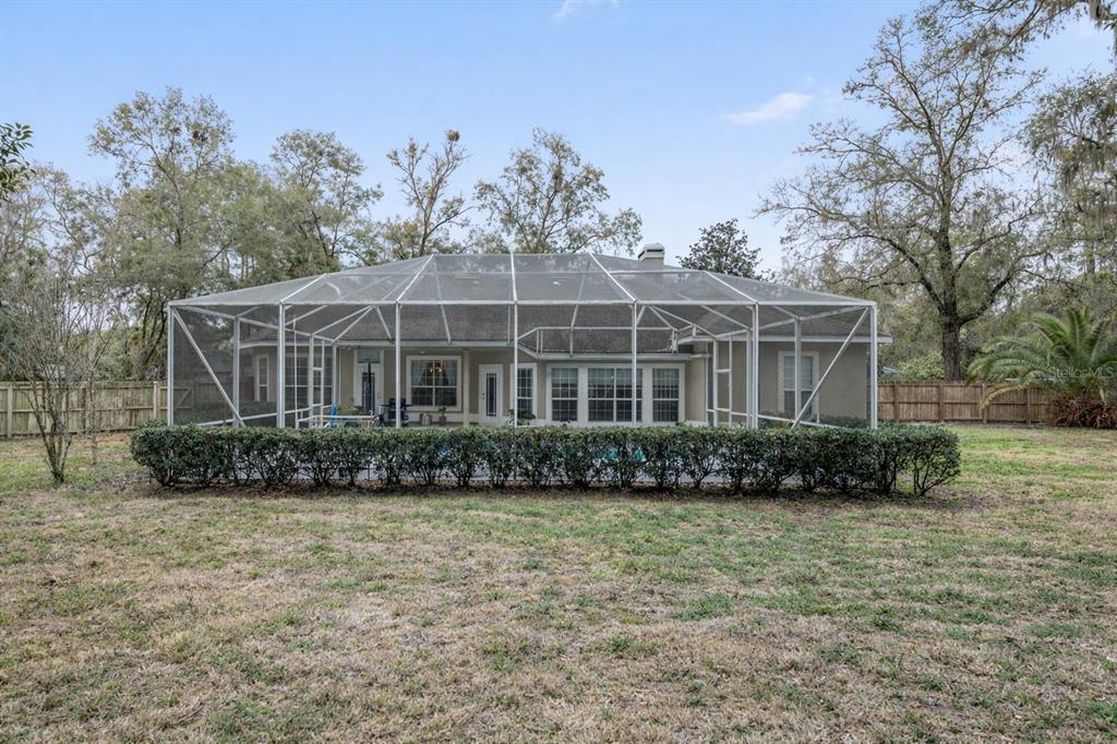 9350 Southwest 46 Place Gainesville, FL 32608 - Photo 61 of 63 a view of a house with a yard
