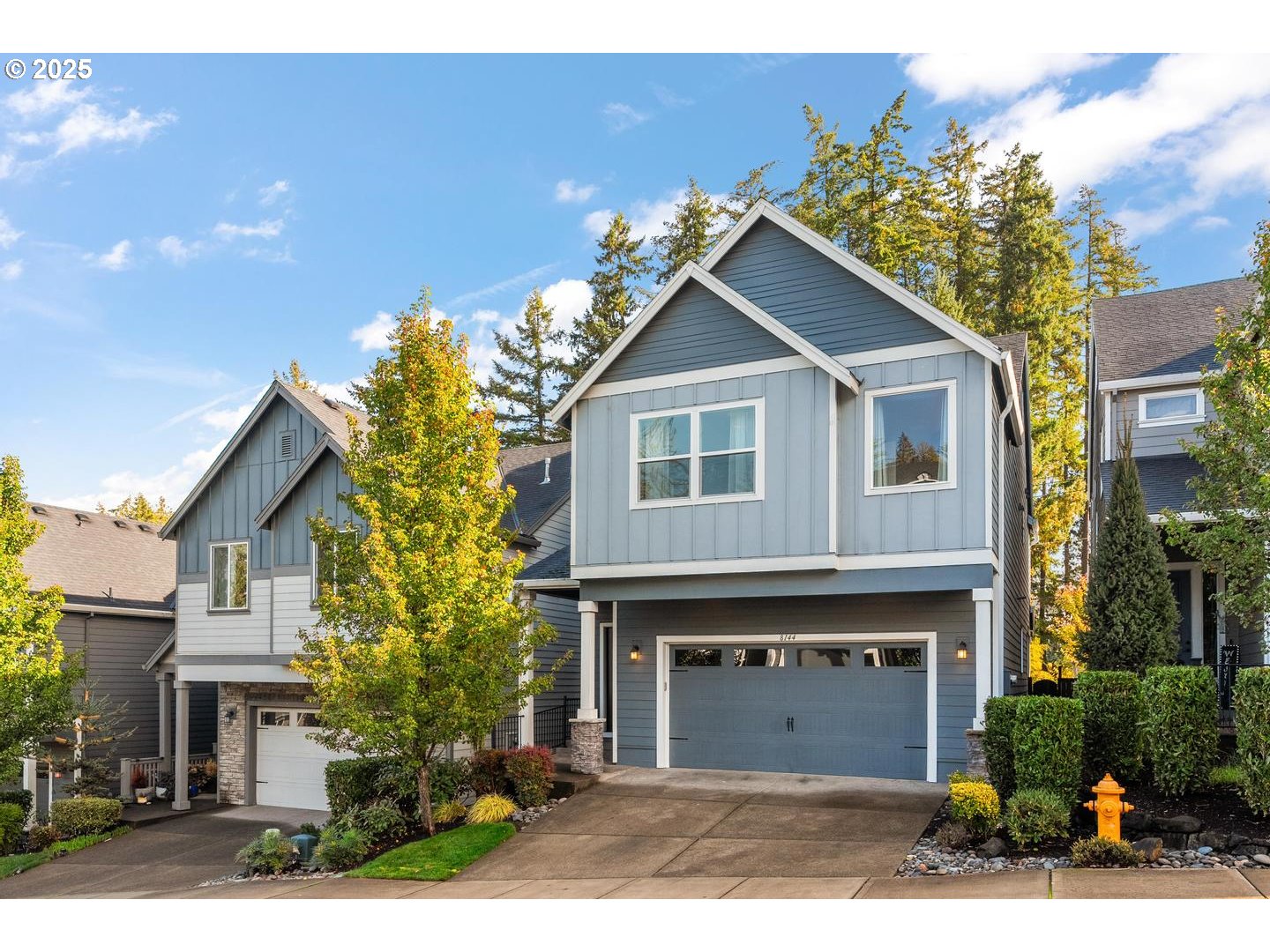 8144 Southwest Oldham Drive Beaverton, OR 97007 - Photo 1 of 33 a front view of a house with a garden