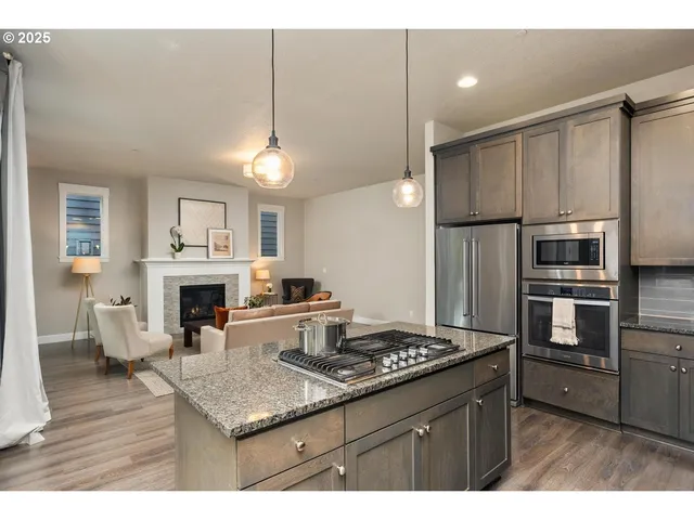a kitchen with sink cabinets and refrigerator