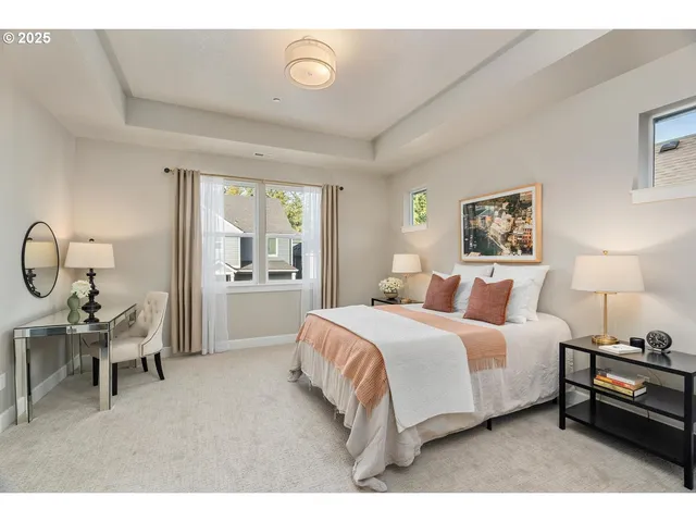 a bedroom with a bed a table and chair