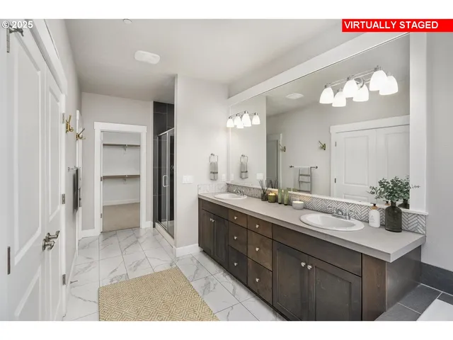 a bathroom with a double vanity sink and a mirror