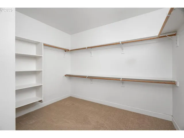 a view of an empty walk in closet