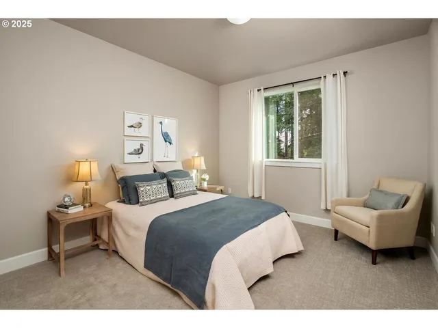 a bedroom with a bed and a couch