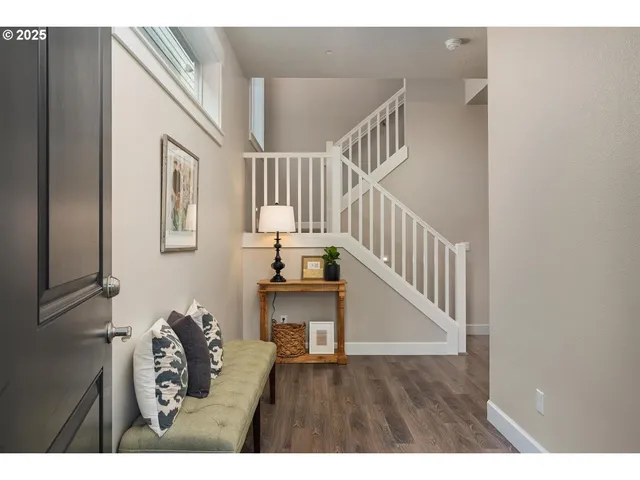 a view of entryway with wooden floor