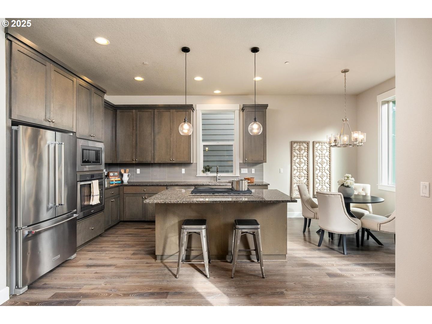 8144 Southwest Oldham Drive Beaverton, OR 97007 - Photo 7 of 33 a large kitchen with a table and chairs