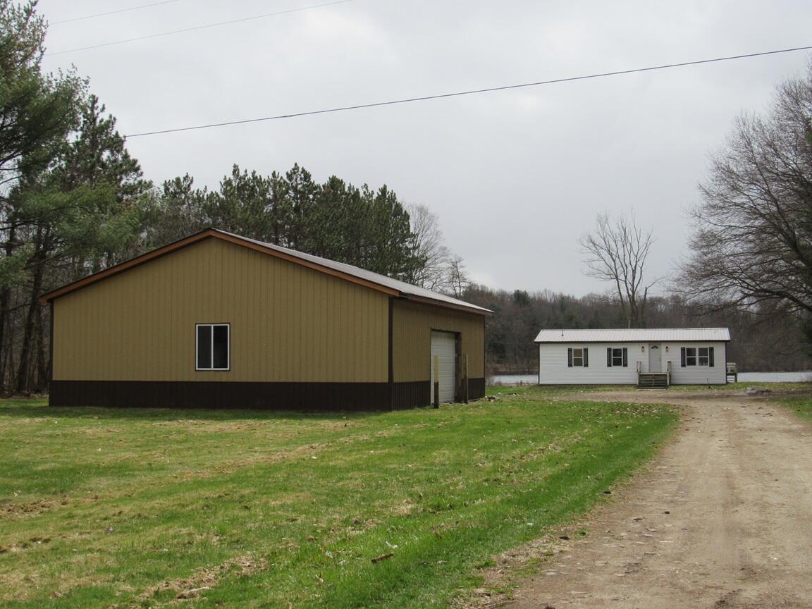 Front of house with pole barn