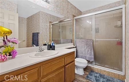 2906 Summer Set Circle Banning, CA 92220 - Photo 11 of 38 a bathroom with a sink toilet and shower