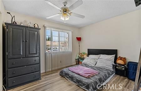 2906 Summer Set Circle Banning, CA 92220 - Photo 12 of 38 a bedroom with a bed dresser and a window