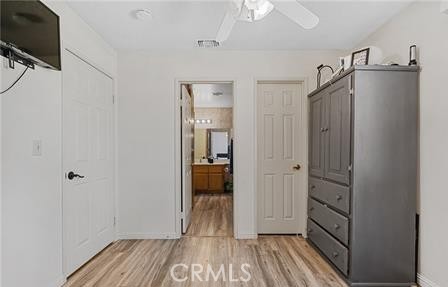 2906 Summer Set Circle Banning, CA 92220 - Photo 13 of 38 a view of a hallway with wooden floor and closet area