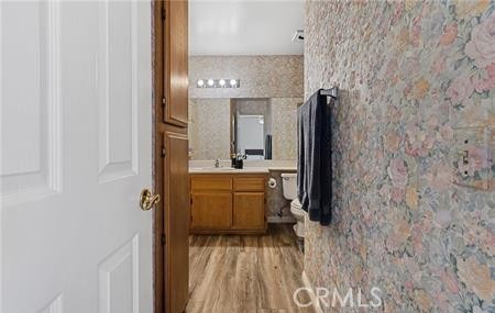 2906 Summer Set Circle Banning, CA 92220 - Photo 14 of 38 a bathroom with a sink and a mirror