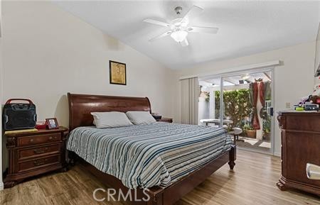 2906 Summer Set Circle Banning, CA 92220 - Photo 15 of 38 a bedroom with a bed and a chandelier