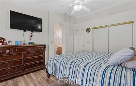 2906 Summer Set Circle Banning, CA 92220 - Photo 16 of 38 a bedroom with a bed and a flat screen tv