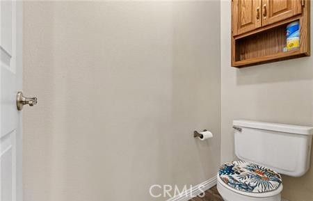 2906 Summer Set Circle Banning, CA 92220 - Photo 19 of 38 a bathroom with a toilet