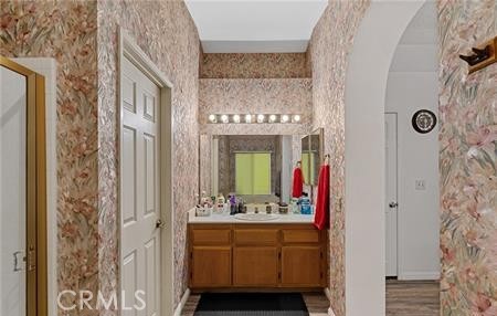 2906 Summer Set Circle Banning, CA 92220 - Photo 20 of 38 a bathroom with a double vanity sink mirror and shower