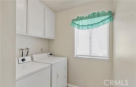 2906 Summer Set Circle Banning, CA 92220 - Photo 21 of 38 a bathroom with a sink a vanity and a window